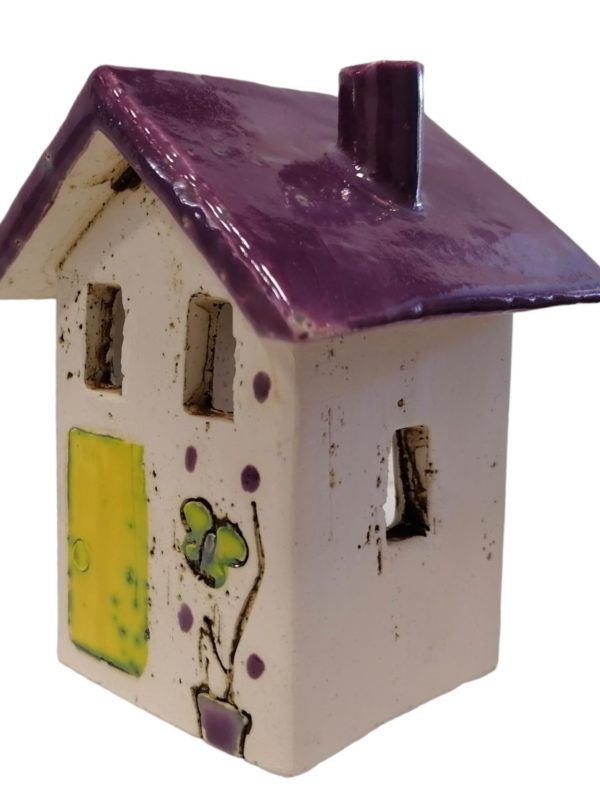 Clay Candlestick House with Purple Roof.